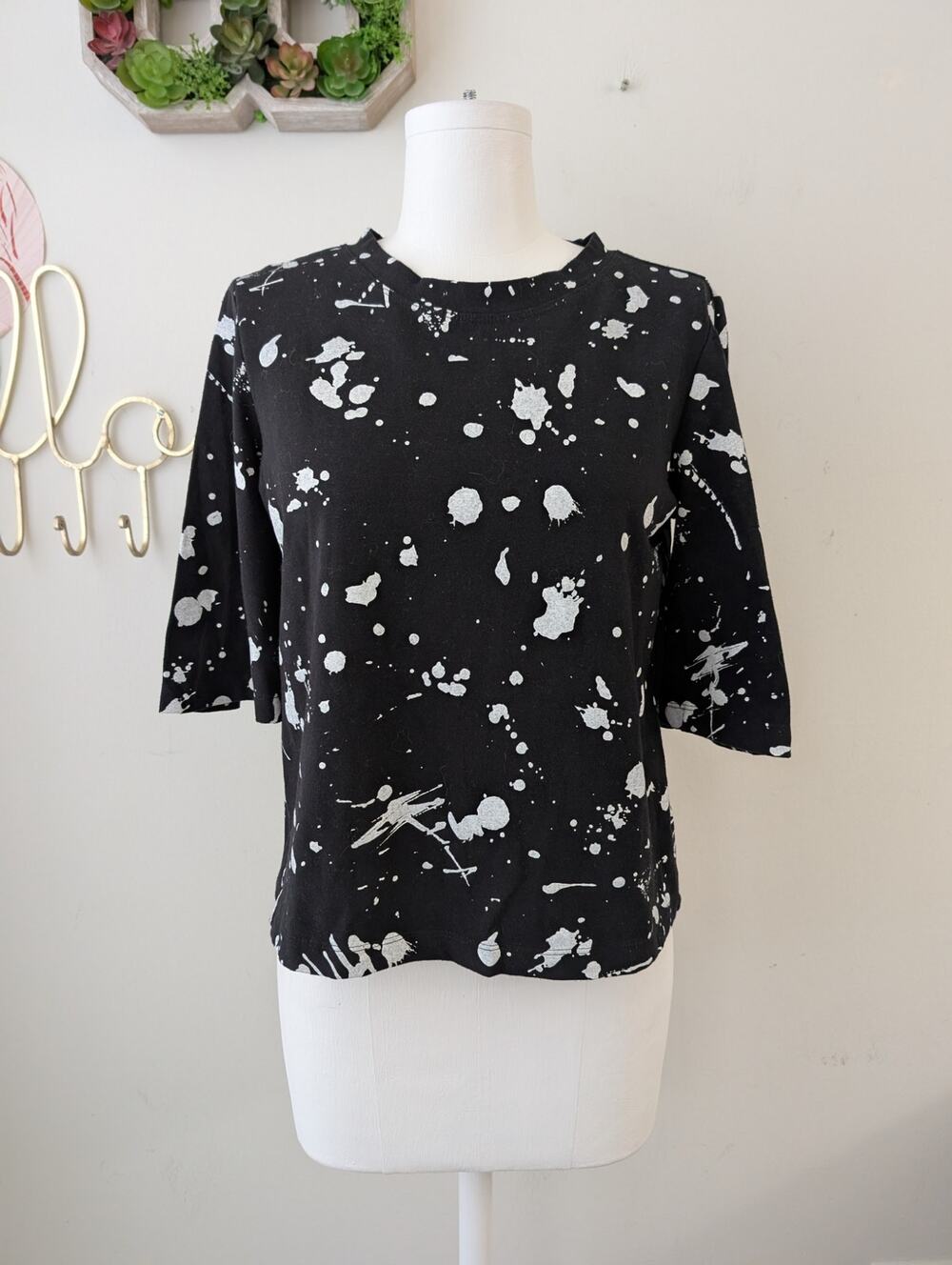 Lobo Mau black splatter paint top with short flare sleeves